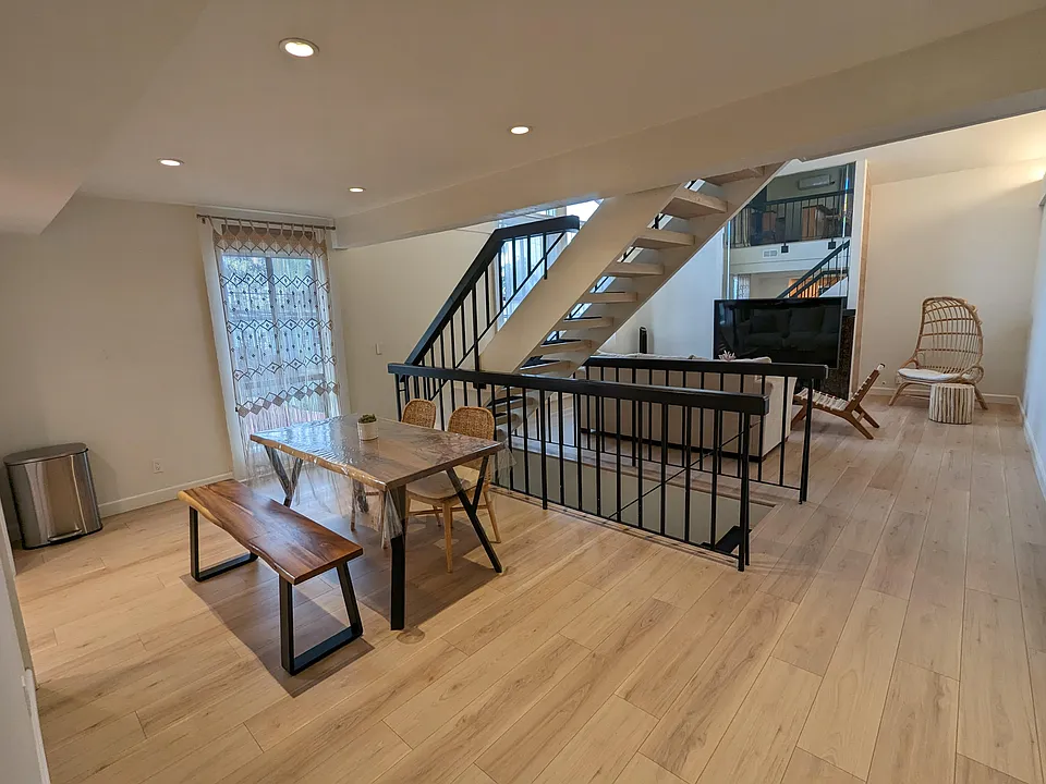 Spacious living room and dining room. New hardwood floor throughout.
