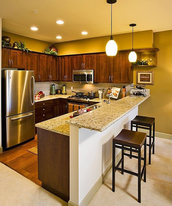 F-2 kitchen has similar finishes but has windows and pantry