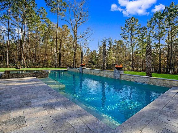 Oversized heated pool with plenty of green space.