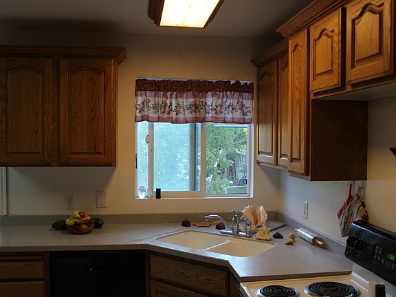 Kitchen overlooks backyard