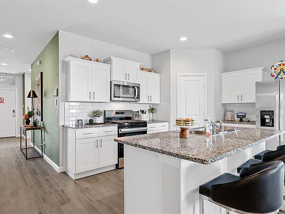 Kitchen-All Home and community information, including pricing, included features, terms, availability and amenities, are subject to change at any time without notice or obligation. All Drawings, pictures, photographs, video, square footages, floor plans, elevations, features, colors and sizes are approximate for illustration purposes only and will vary from the homes as built.