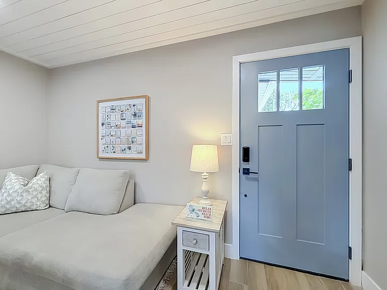 This is not your normal entry way. This space is fully furnished with full size couches, TV, bedroom sets and kitchen.