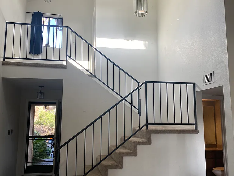 Stairs to primary bedroom