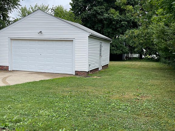 2-Car Garage with Walk-In Door and Back Yard