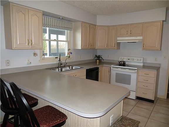 Large Country Kitchen with Bar Seating