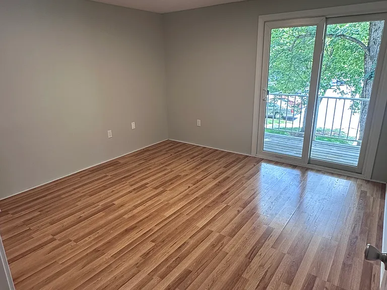 Bedroom with slider door to balcony