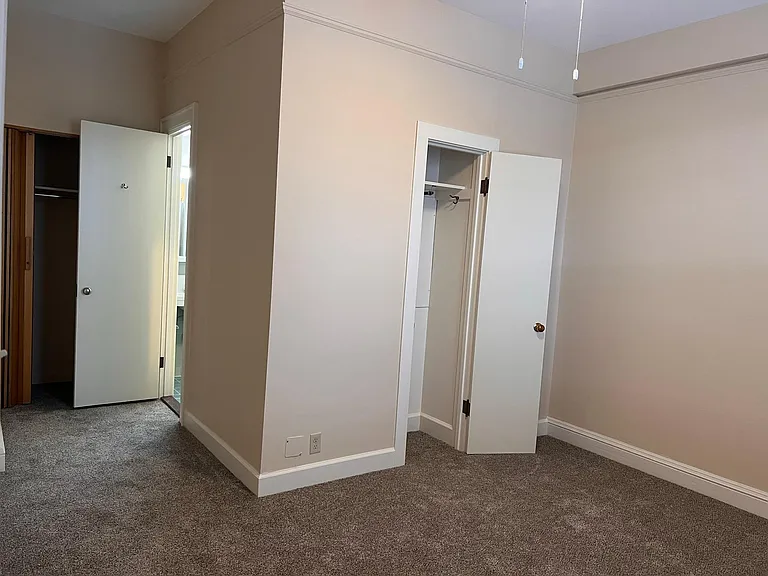 Bedroom #1. Features two closets and bathroom with shower.