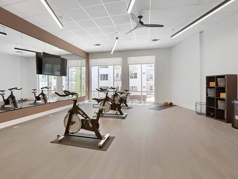 Ride at your own pace. The Garrett Uptown dedicated spin and yoga studio features SILK cycling bikes, full mirrored walls, space for stretching, and a wall-mounted TV _ no gym membership required.