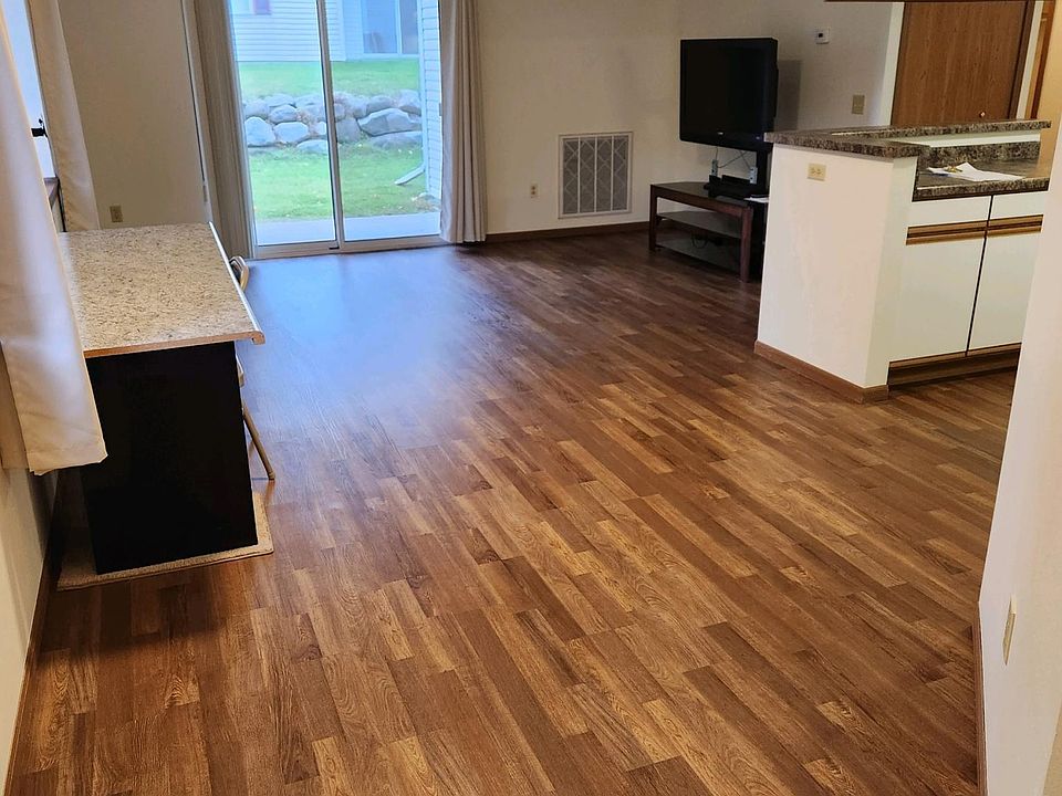 Front Door at Kitchen & Living Room (desk on left wall and tv/coffee table belonged to previous tenant - are not included)