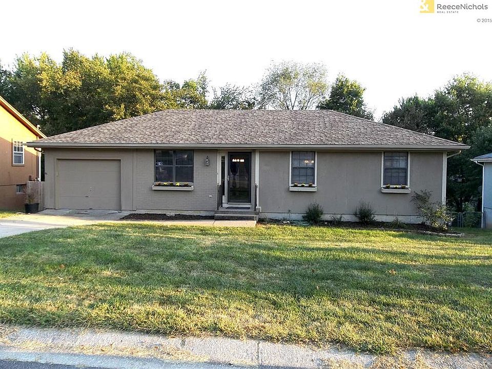 Ranch style home with partial finished walkout lower level.
