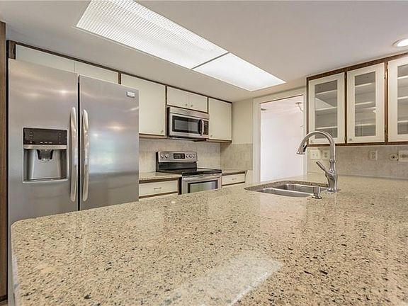Yes, that is one solid slab of granite and newer stainless steel appliances!! :-)