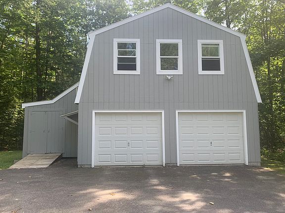 Use of 2-car garage, workspace, and storage on left included.