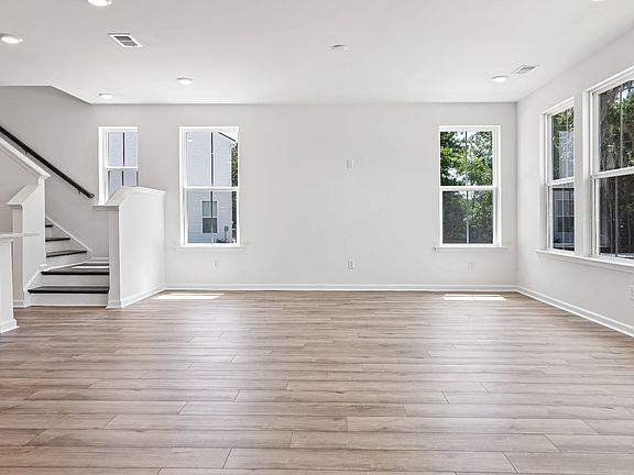 Large open concept heron floor plan by DRB Homes expansive light and spacious seating