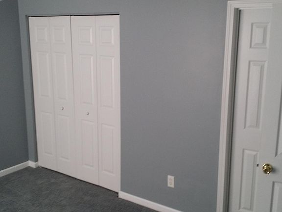 Master bedroom & closet. This is a similar unit, not the actual unit. The floorplan is the same, but the paint is teal and carpet is off-white.