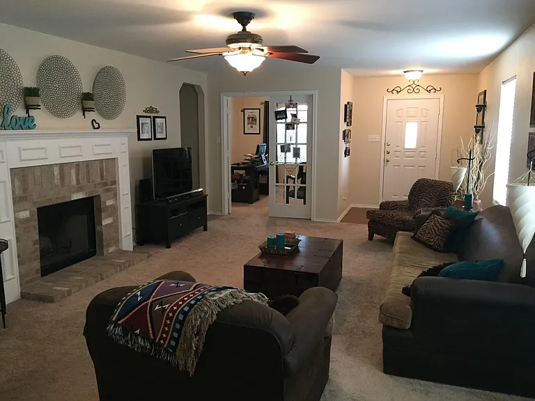Living Room with Fireplace - new vinyl flooring being installed June, 2026.