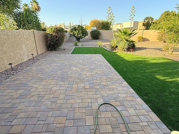 Pavers and Fake Turf in Backyard