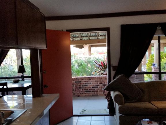 kitchen bar, views to open space/park tropical garden