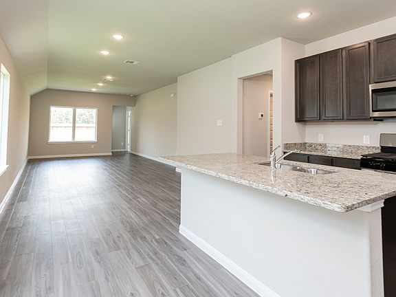 Kitchen and Dining Area to Family Room