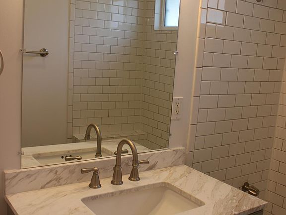 Main bathroom with marble-top vanity
