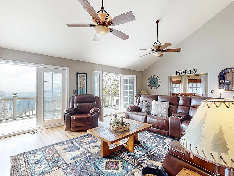 Living room with front deck showcasing views.
