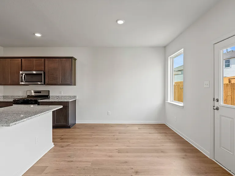 The dining room sits right off of the kitchen and has a large window.