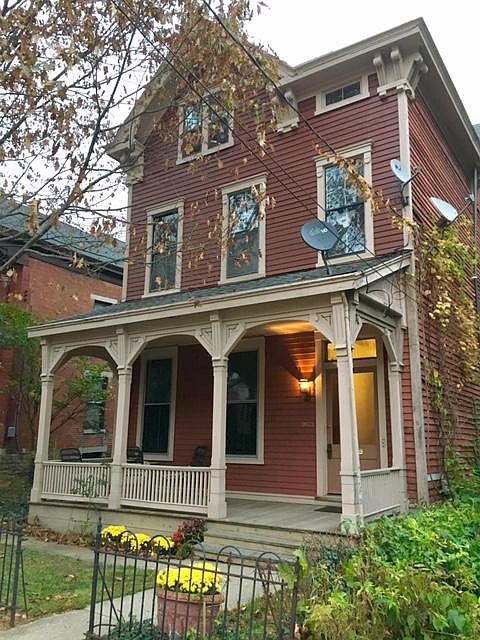 Front of house, original wrought iron fence, front porch