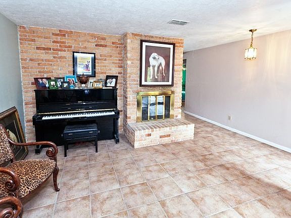 Tile floors and wood laminate are found throughout this home