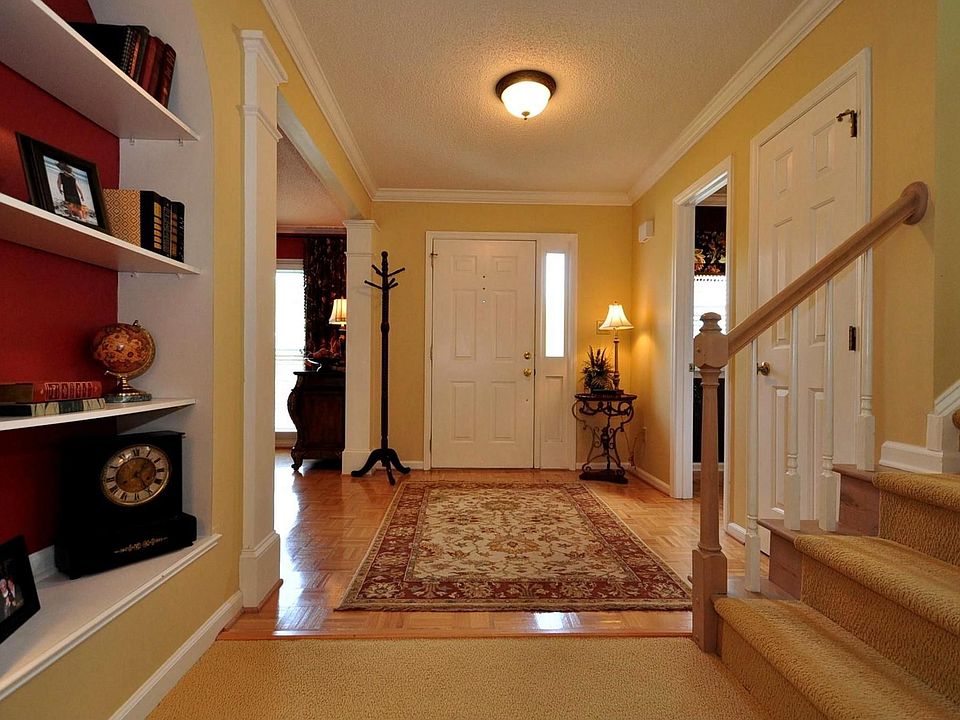 Open foyer with parquet floors