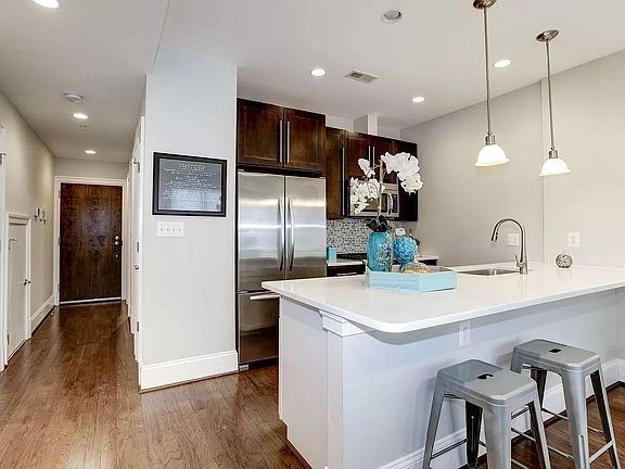 Stainless steel appliances in open kitchen