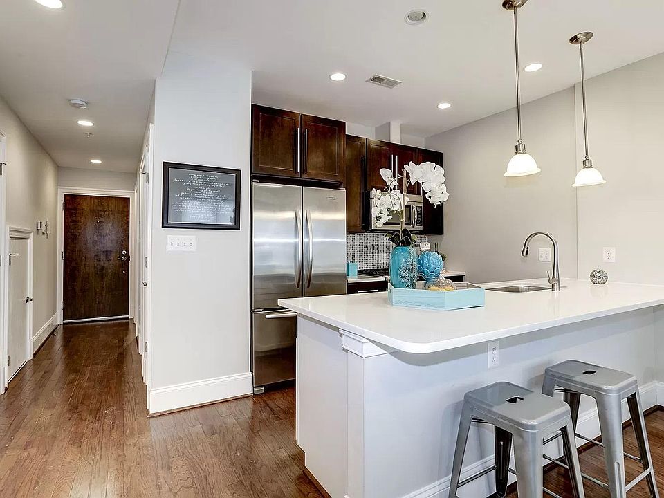 Stainless steel appliances in open kitchen