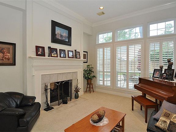 Living Room with High Ceiling and Floor Length Windows
