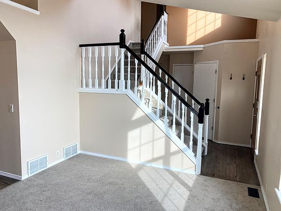 Front living room, brand new carpet in the entire home.