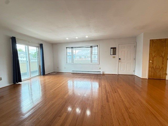 Main living area with large sliders viewing ocean.