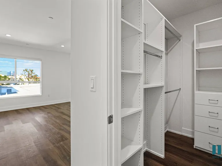 Bedroom with Walk-In Closet with Built-In Organizers