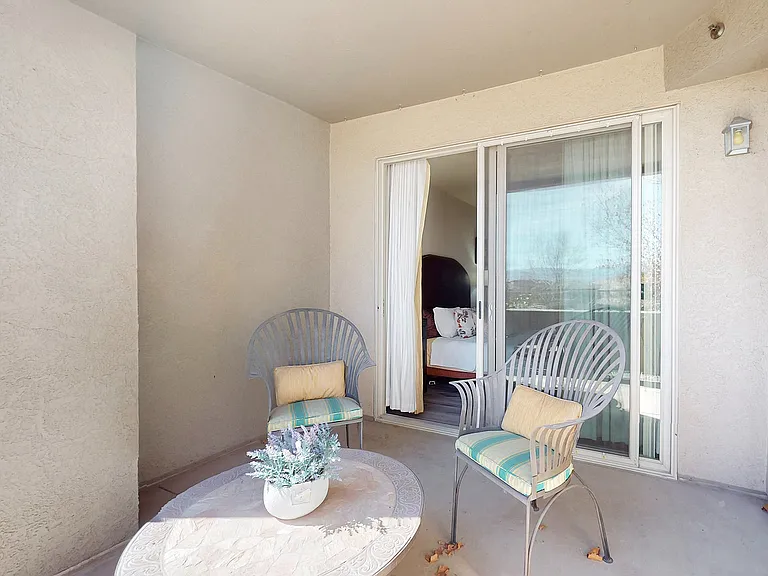 Relax and unwind on this charming balcony, offering a serene outdoor escape.
