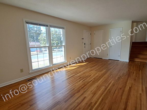 Hardwoods refinished recently upstairs and in living room, plus new LVP flooring in kitchen and downstairs bedroom and den.