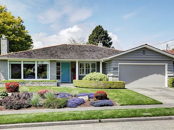 Beautiful Mid Century home close to Discovery Park with two car garage with EV plug-in.