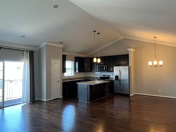 Kitchen, dining area and balcony