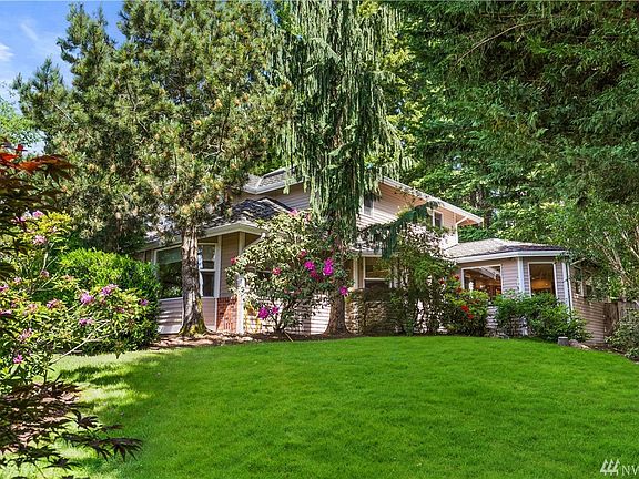 This home is situated on 1.03 acres of beautiful landscaping