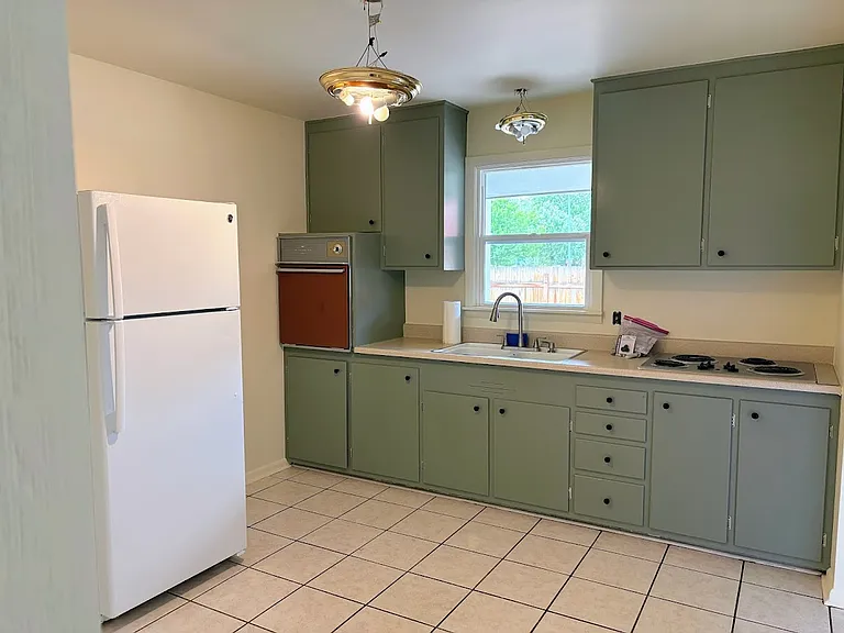 Freshly painted cabinets, walls, ceiling and trim. New hardware, blinds and light fixtures installed. Portable small kitchen butcher block with 2 stools included. (Updated photos forthcoming)