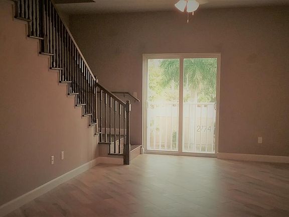 STAIRS TO 2 BDRMS & LIVING AREA