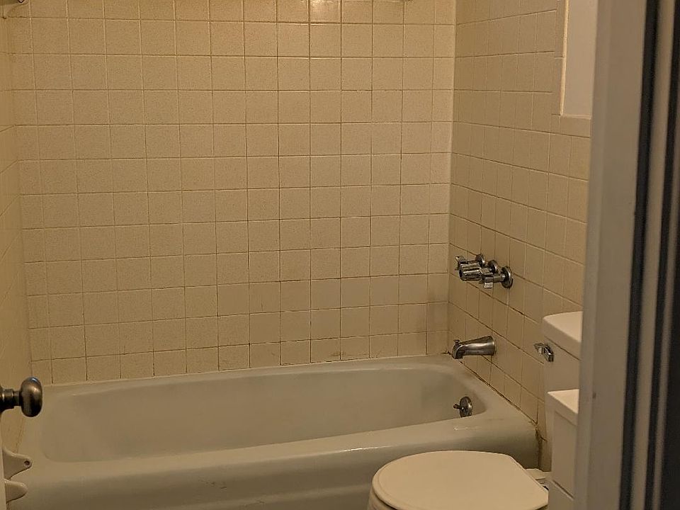 BATHROOM EQUIPPED WITH A TUB AND SHOWER.
