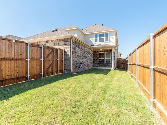 New Construction Spacious, fenced-in backyard with covered patio.