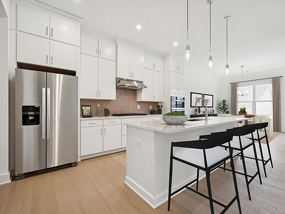 Spacious kitchen with ample cabinet storage and kitchen appliances