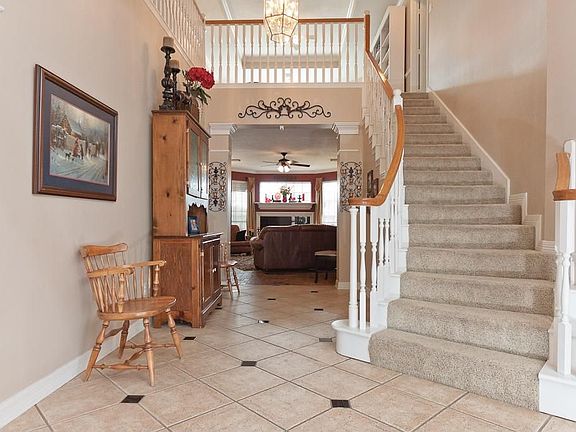 Dramatic Entry has a curved staircase.Wide entrance allows for decorating.
