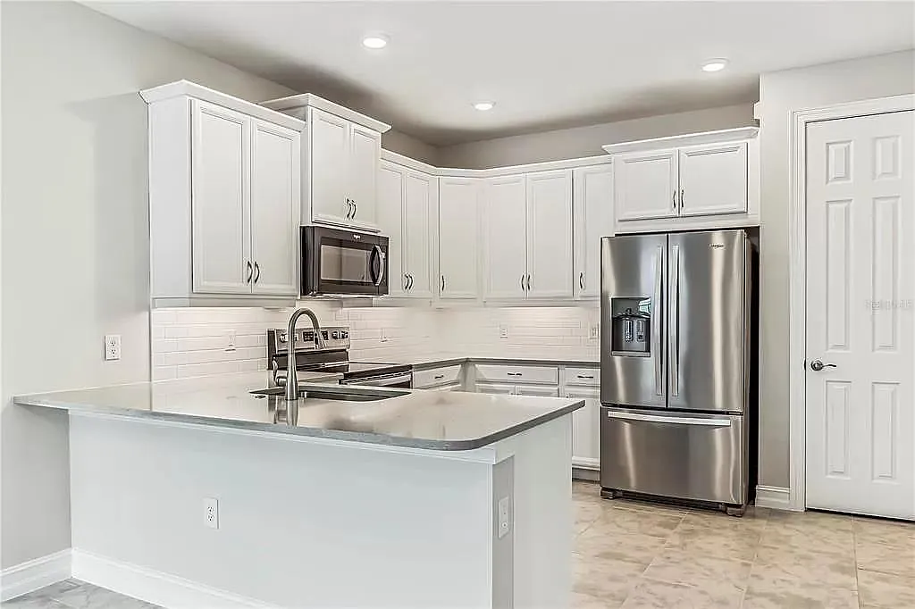 fully appointed kitchen with all appliances and quartz countertops. - 352 Ibiza Loop