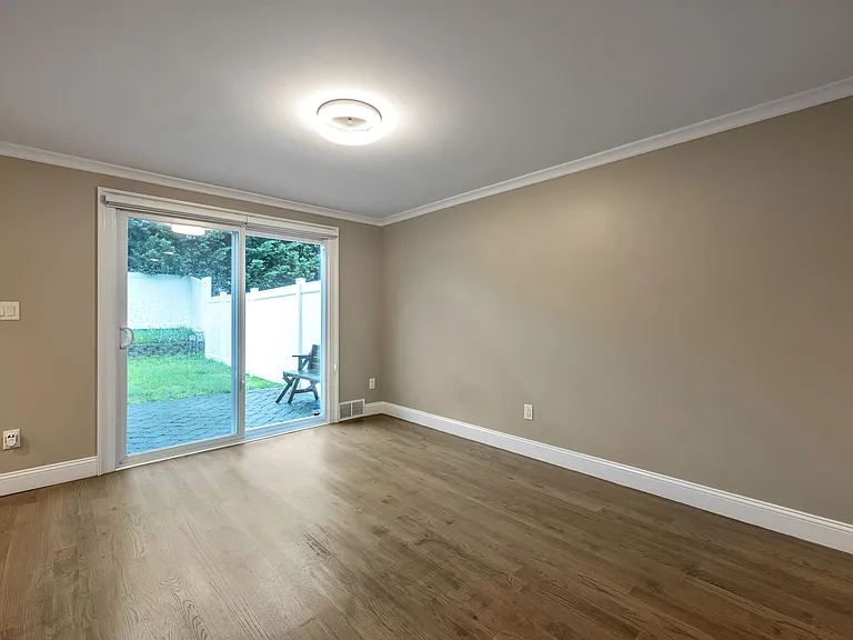 Spacious Dining Room with Sliders to the Rear Yard