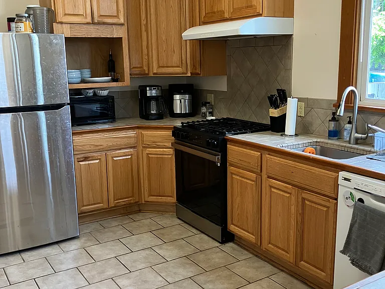 Spacious kitchen viewed from dining area.