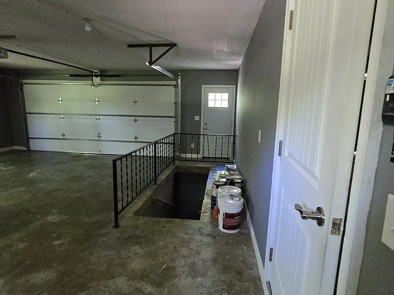 Garage with storm shelter access