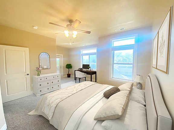 Master Bedroom with view of the mountains to the east and door to balcony.